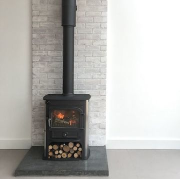 modern polished concrete hearth made by concrete tuesdays with a clearview stove exposed flue