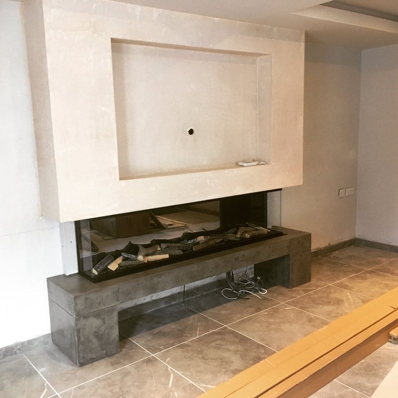 modern polished concrete t shaped one piece hearth  with a clearview stove